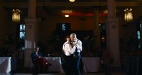 gay couple dancing at heritage hall on their wedding day