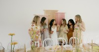 bride and bridesmaids enjoying a moment together