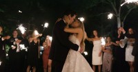 guests holding sparklers during first dance