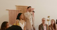 interracial couple making speech during dinner reception