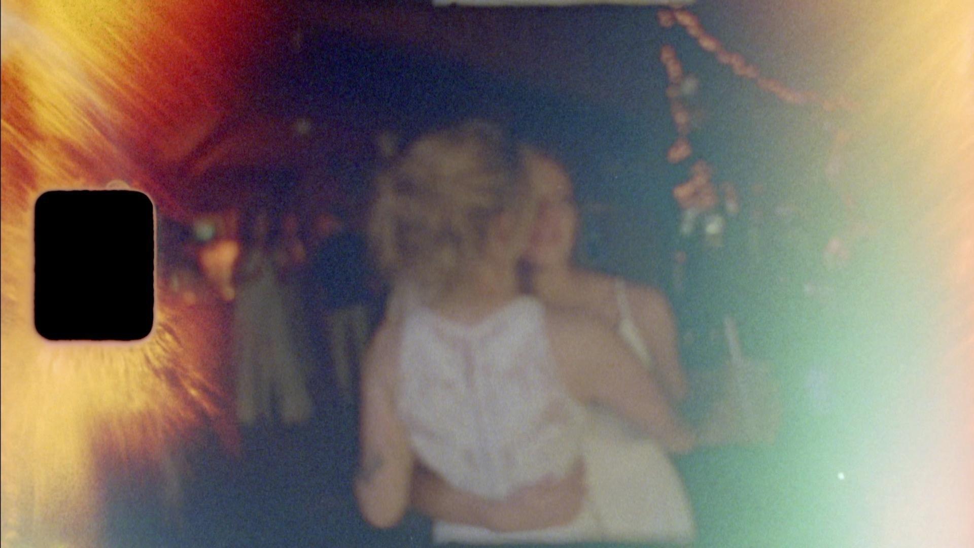 super 8mm film capturing two brides dancing