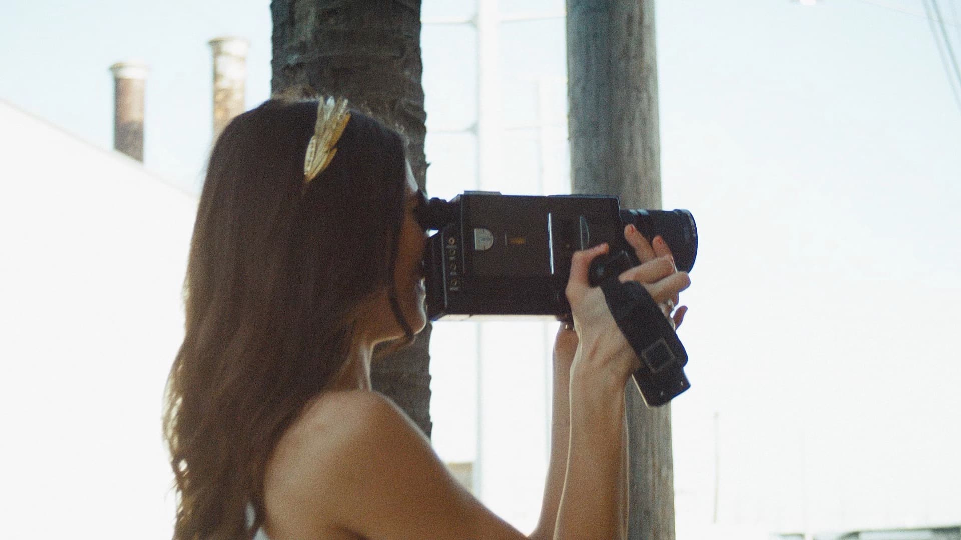 bride filming groom using vintage super 8 camera