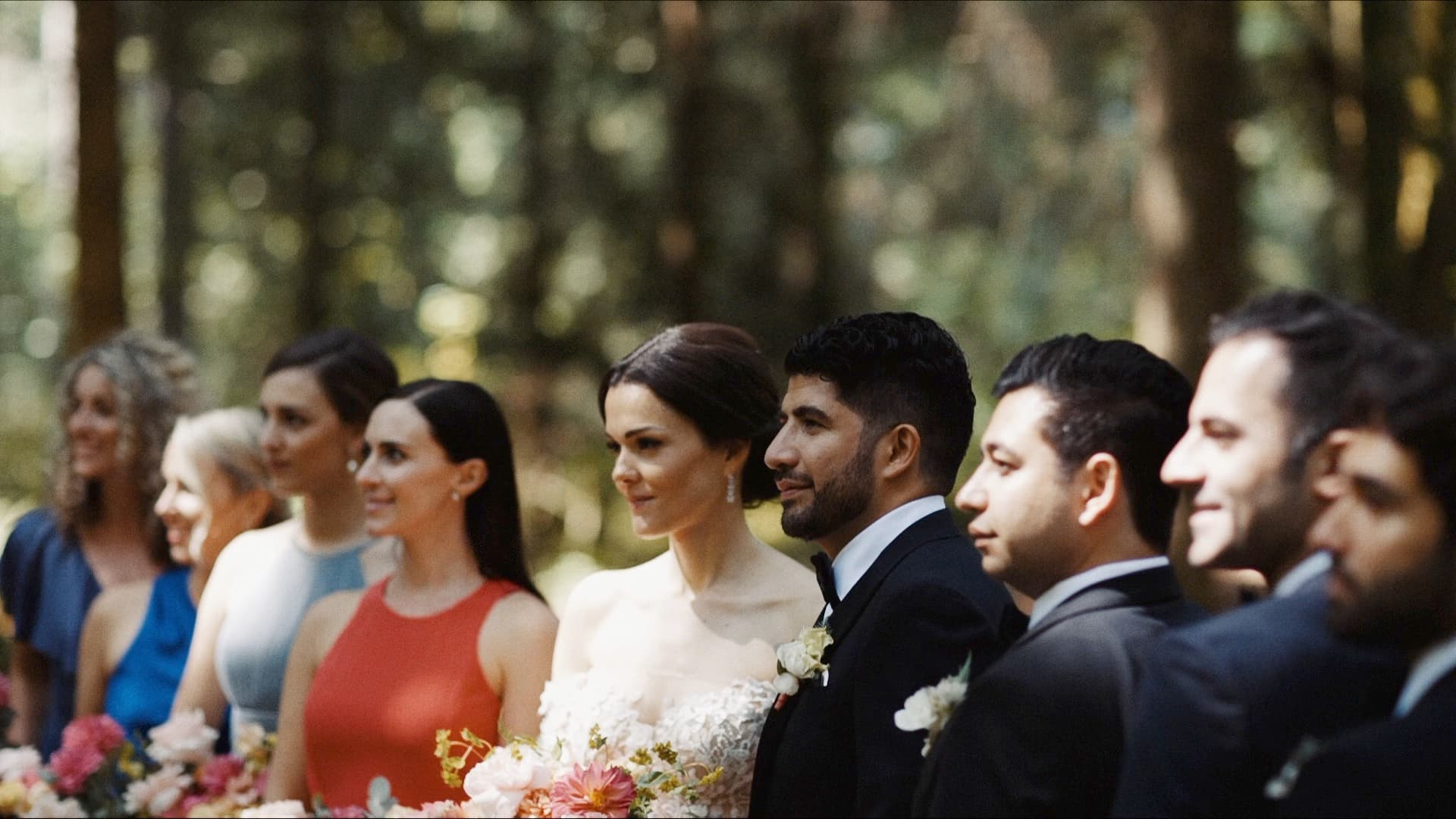 wedding party standing in stanley park