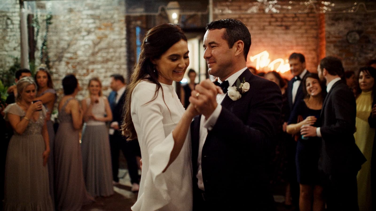 wedding couple during their first dance at race and religious