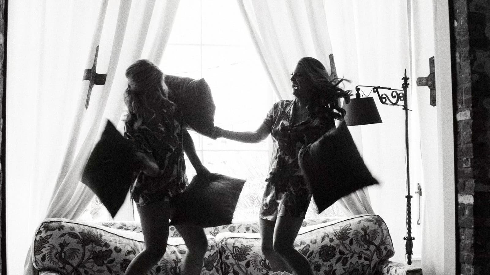 8mm film still of two women having a pillow fight