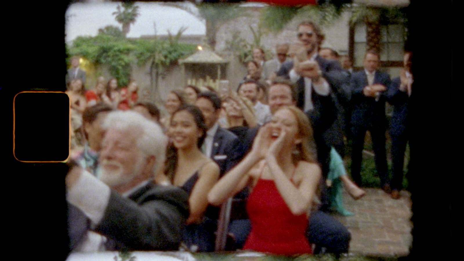 super 8mm film still of guests attending a wedding at race and religious