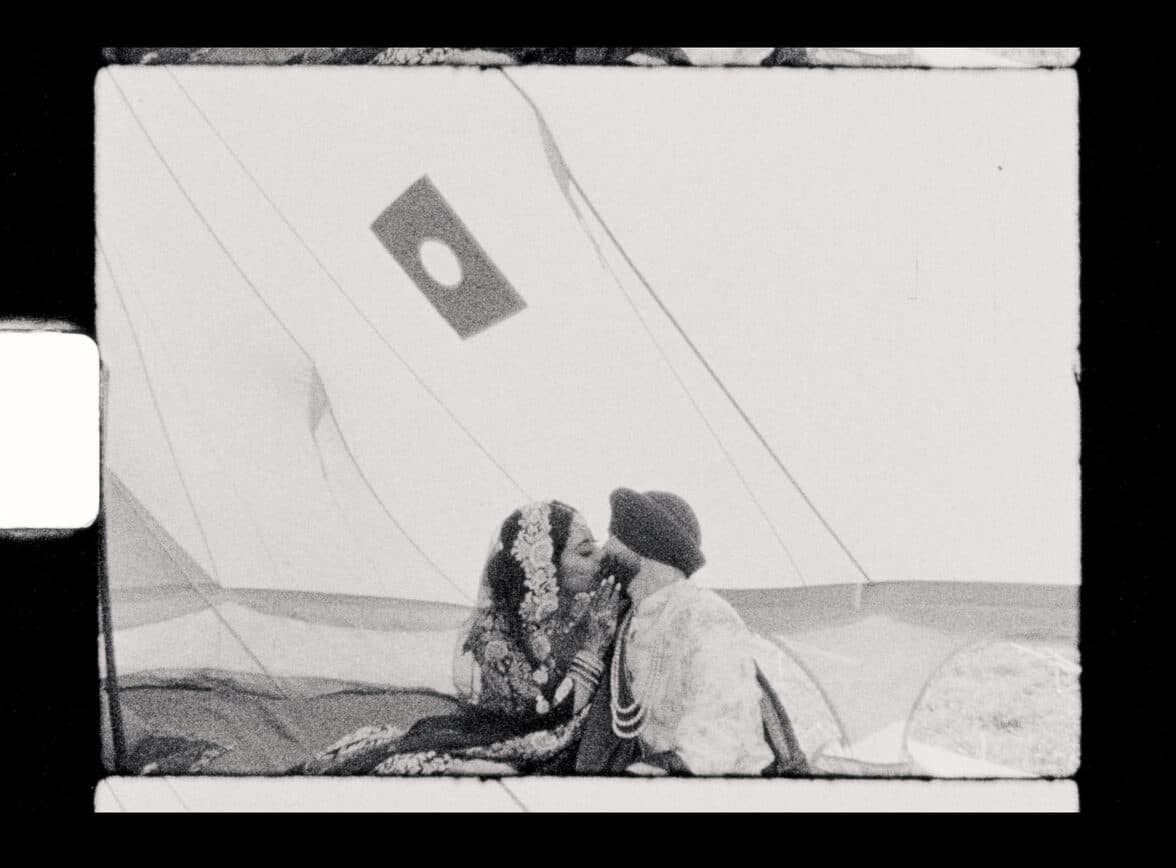 sikh wedding couple kissing inside tent in pemberton